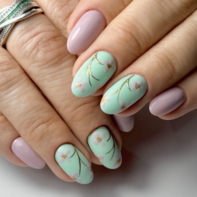 Subtle mint green leaf nail art by The Nail Editor