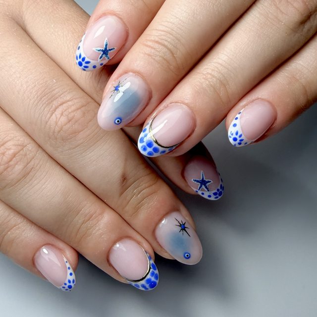 Blue and white florals with star accents by The Nail Editor