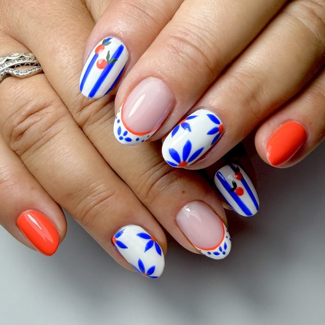 Cobalt petals with a bright coral accent by The Nail Editor