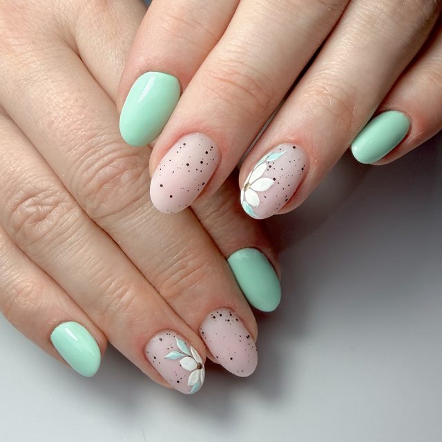 Mint and white blooms on a soft base by The Nail Editor