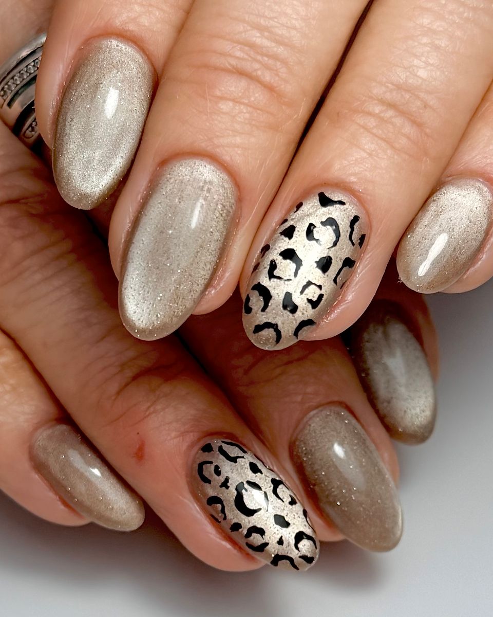 Champagne glitter and leopard nail art by The Nail Editor