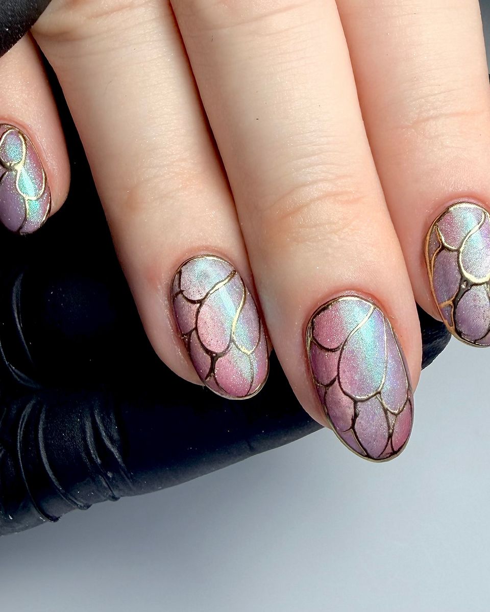 Iridescent chrome nails with gold outlined scales by The Nail Editor