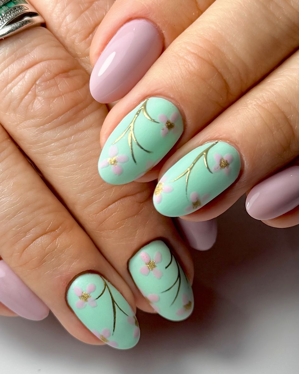 Subtle mint green leaf nail art by The Nail Editor
