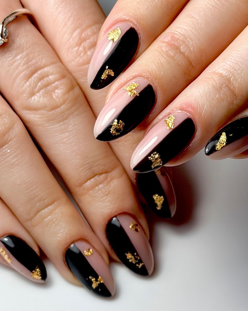 Black and nude diagonal nails with gold leaf detail by The Nail Editor