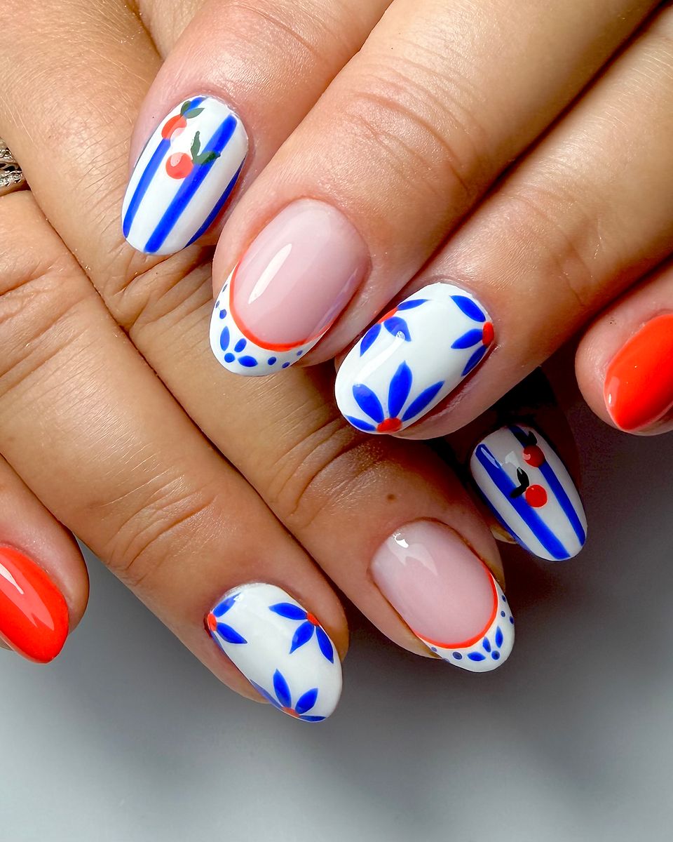Cobalt petals with a bright coral accent by The Nail Editor