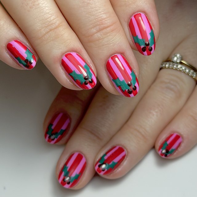 Candy stripes with hand-painted holly by The Nail Editor