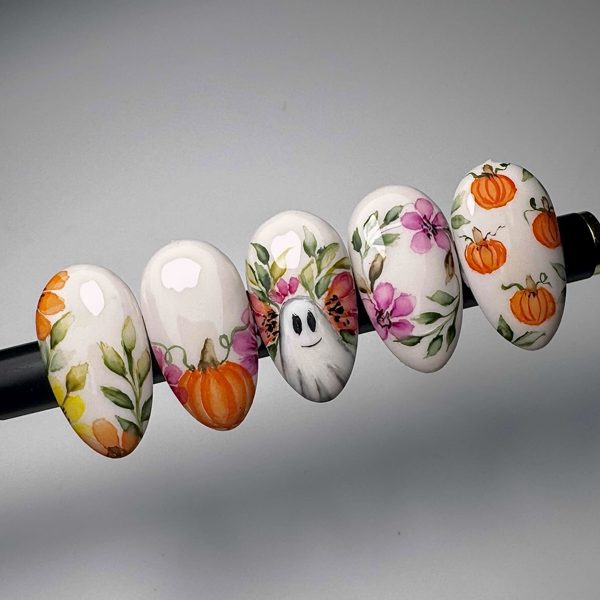 Autumn pumpkin and floral nail art on tips by The Nail Editor